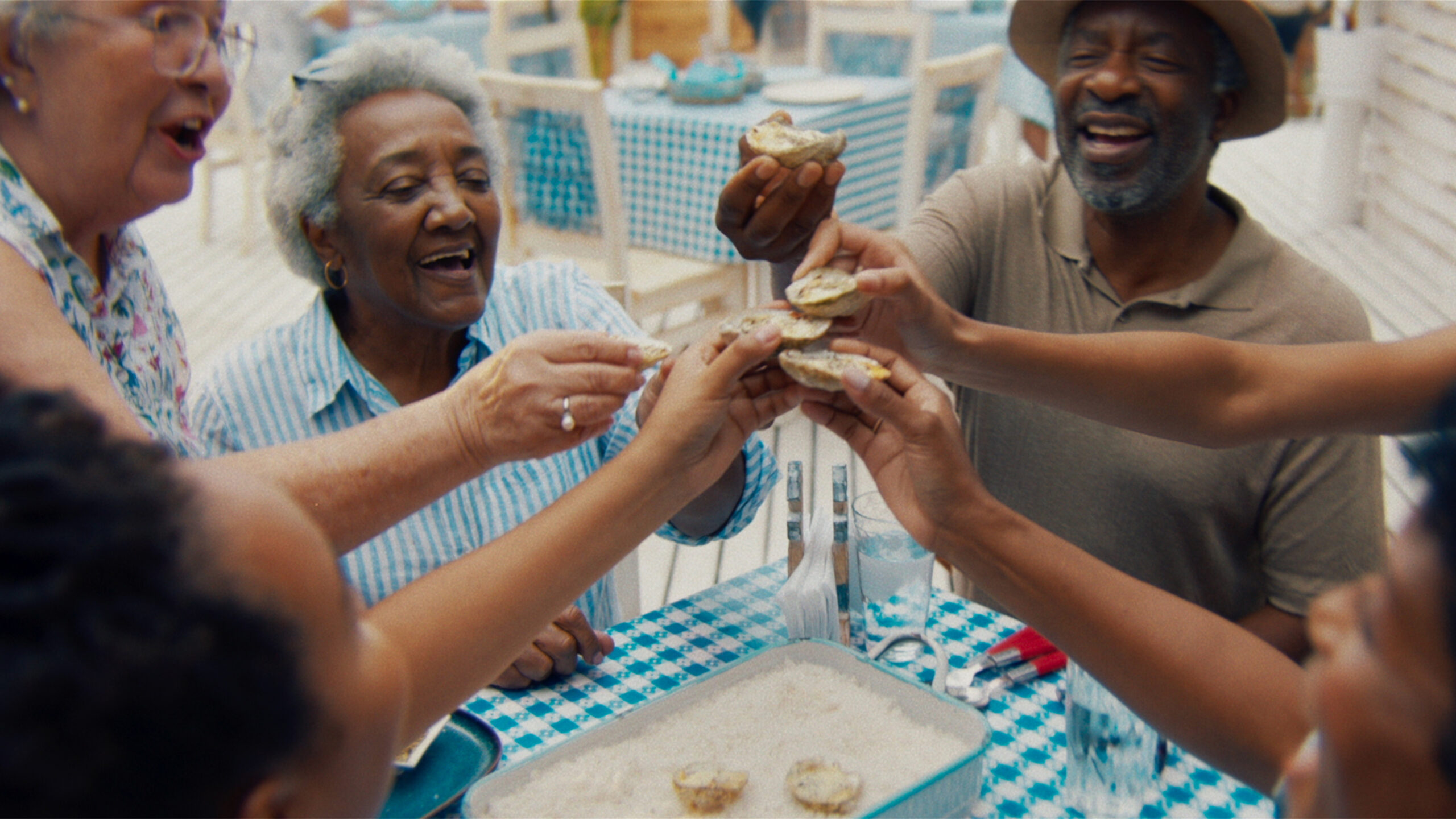 People enjoying drinks around a table.